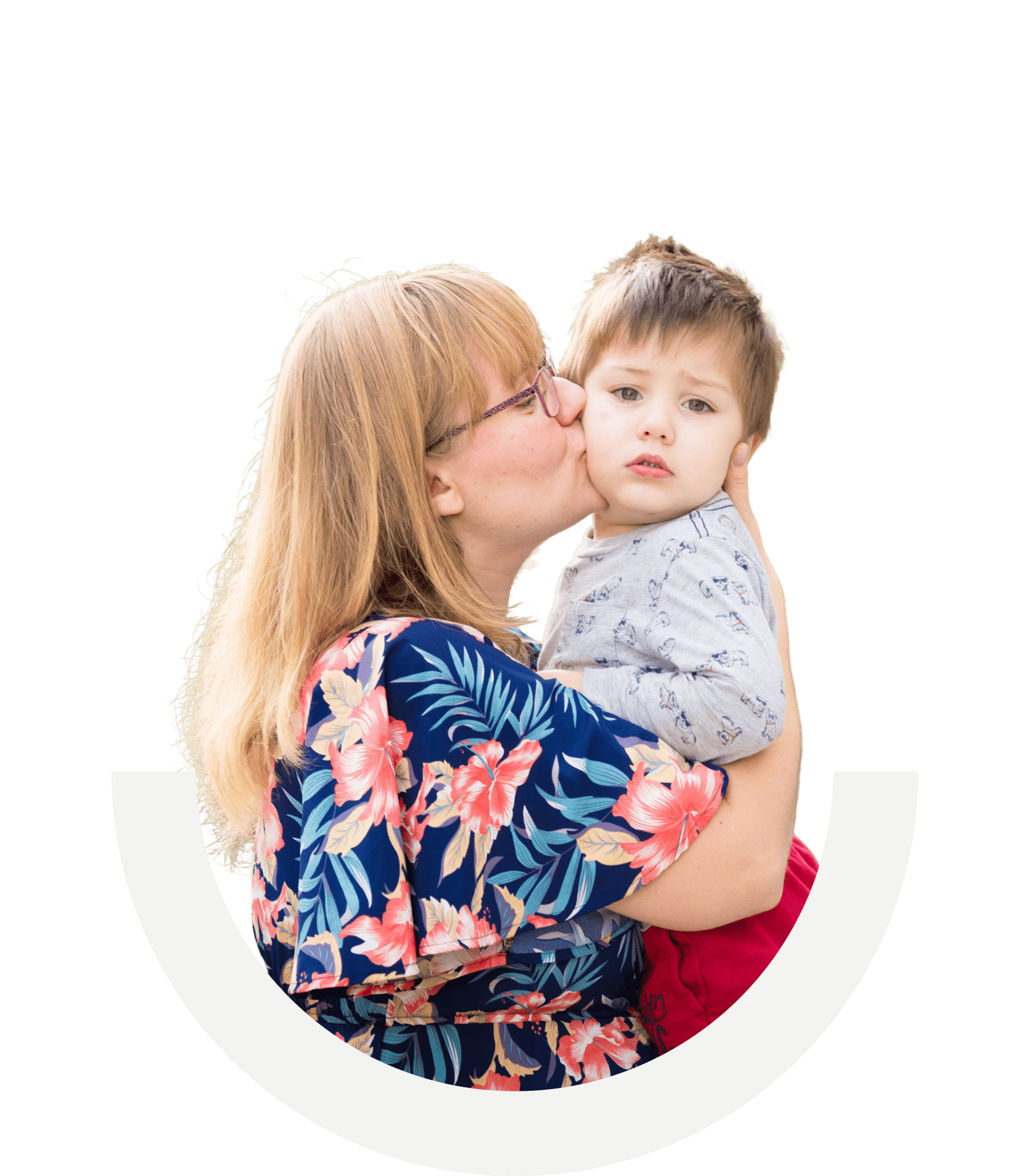 Cut out of a woman holding her son and kissing his cheek