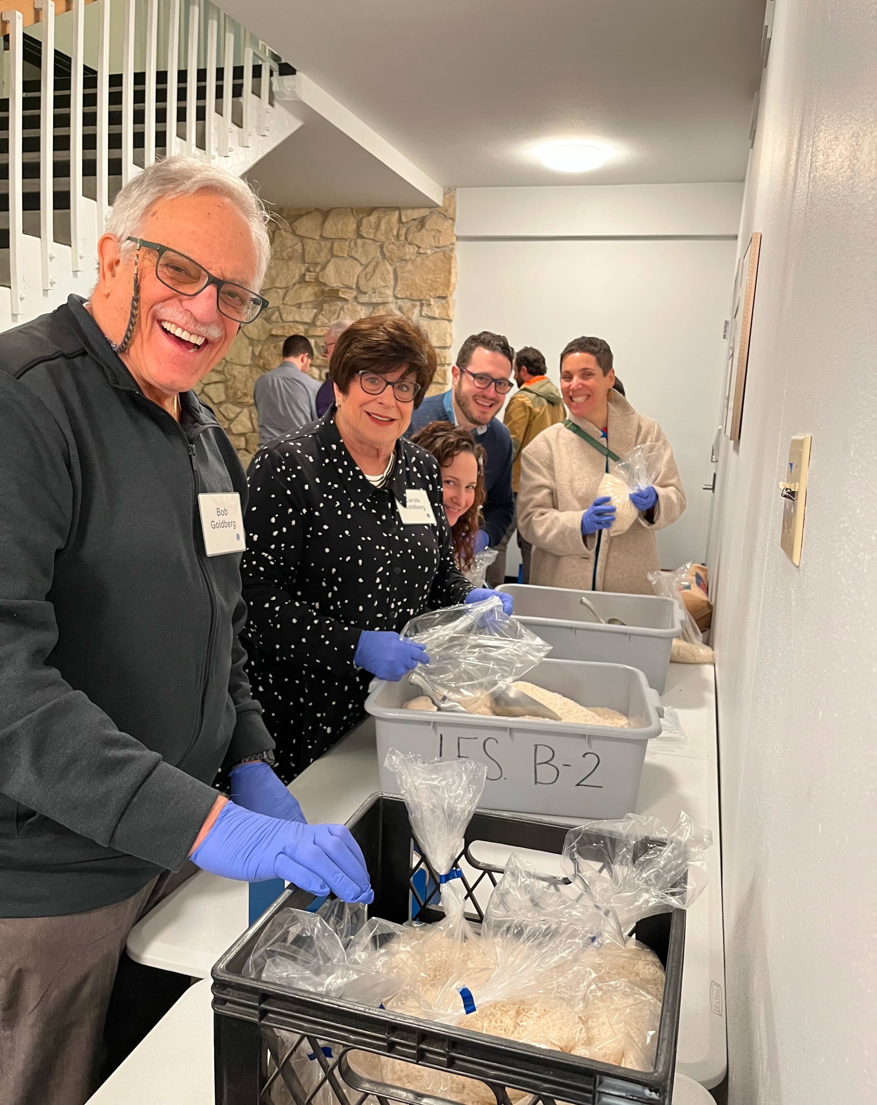 Volunteers helping prepare and package food