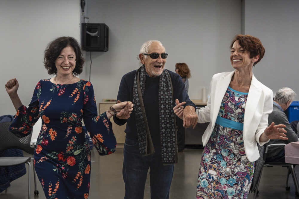 three people dancing