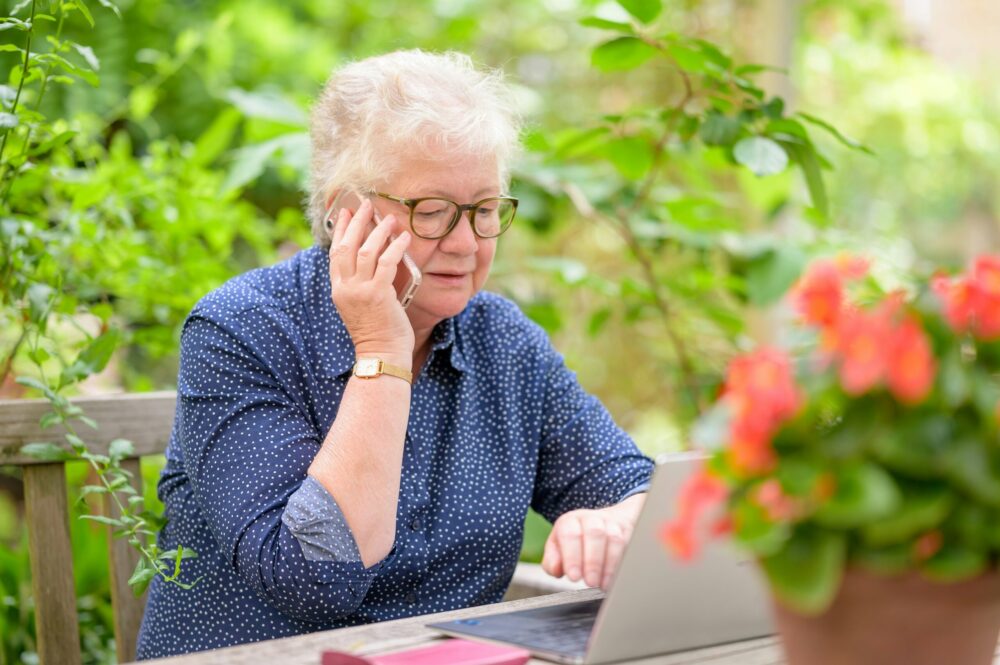 older woman in front of a laptop computer