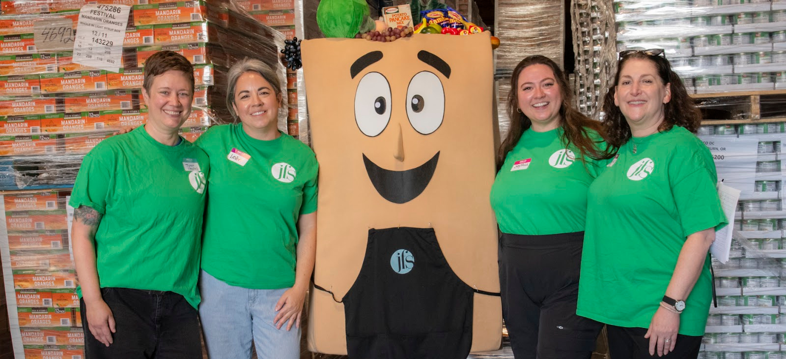 Four JFS employees with Baggie at the Food Sort