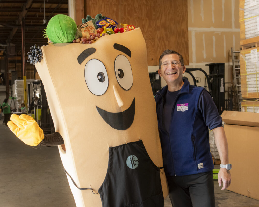 Board President Eric LeVine with Baggie at the Food Sort