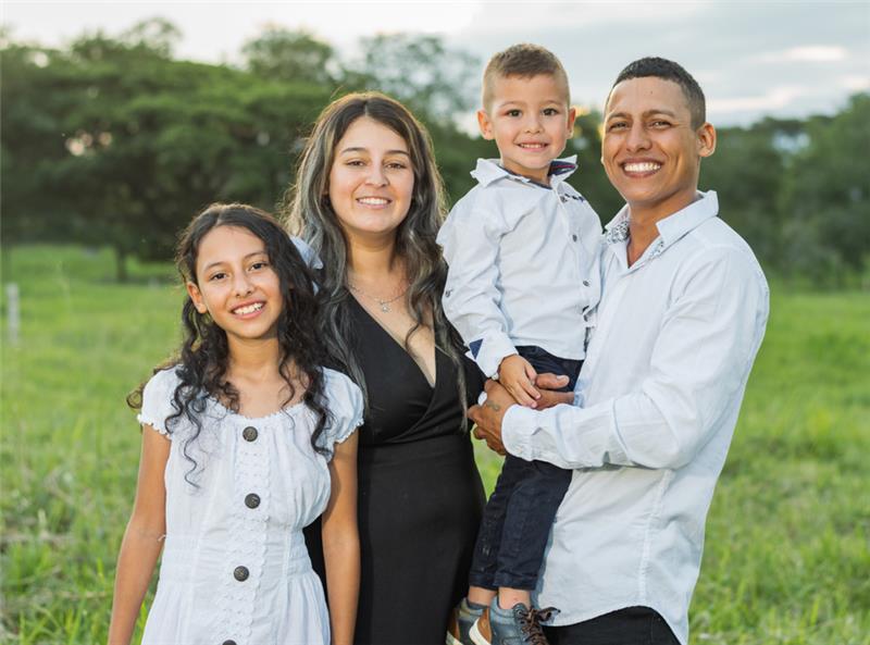 Family of four in a park setting